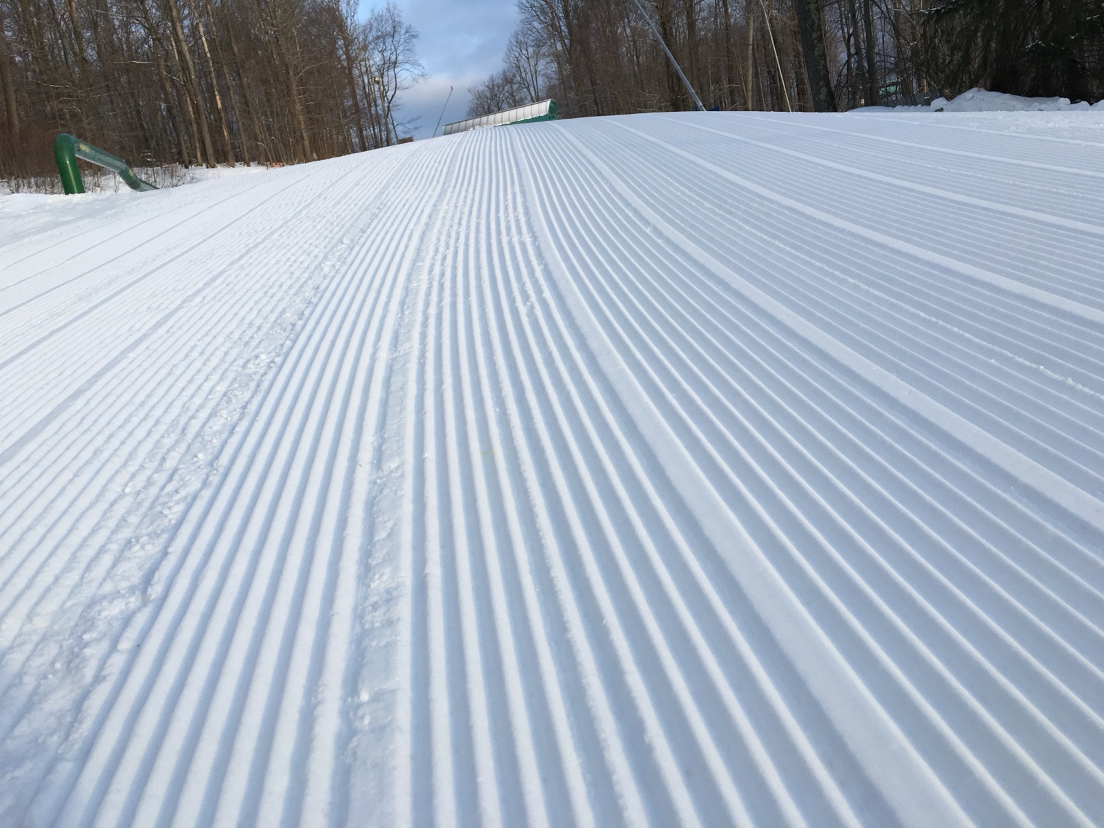 Fresh corduroy climbing a freshly groomed run at Ellicottville on a winter morning