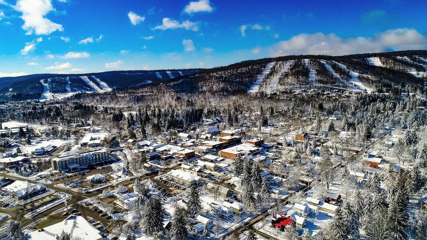 Aerial of the village of Ellicottville under snow